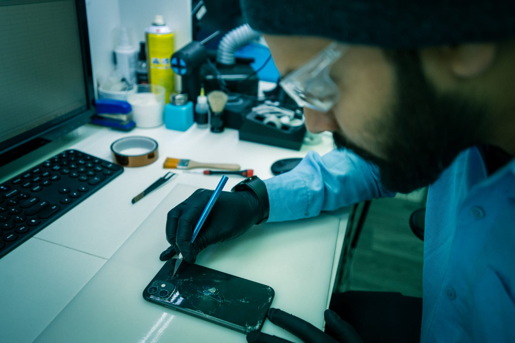 technician-performing-laptop-repair